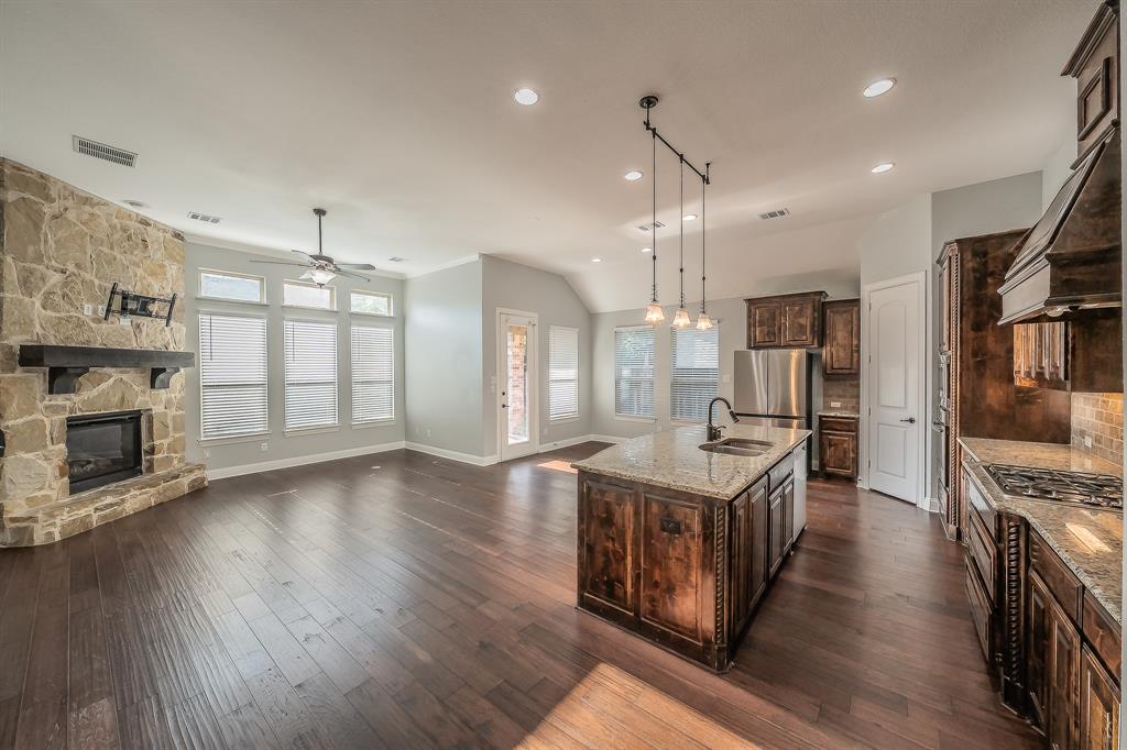 2823 Exeter Drive Trophy Club, TX 76262 - Photo 40 of 40 a kitchen with stainless steel appliances granite countertop a refrigerator a stove oven and a wooden floors