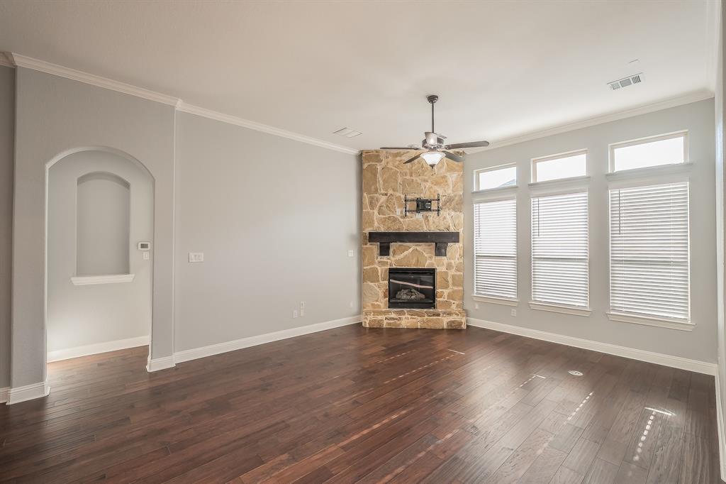 2823 Exeter Drive Trophy Club, TX 76262 - Photo 16 of 40 an empty room with wooden floor fan and windows