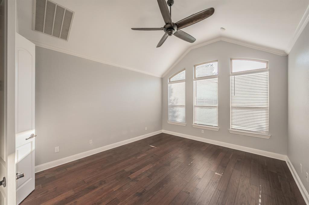 2823 Exeter Drive Trophy Club, TX 76262 - Photo 23 of 40 an empty room with wooden floor fan and windows