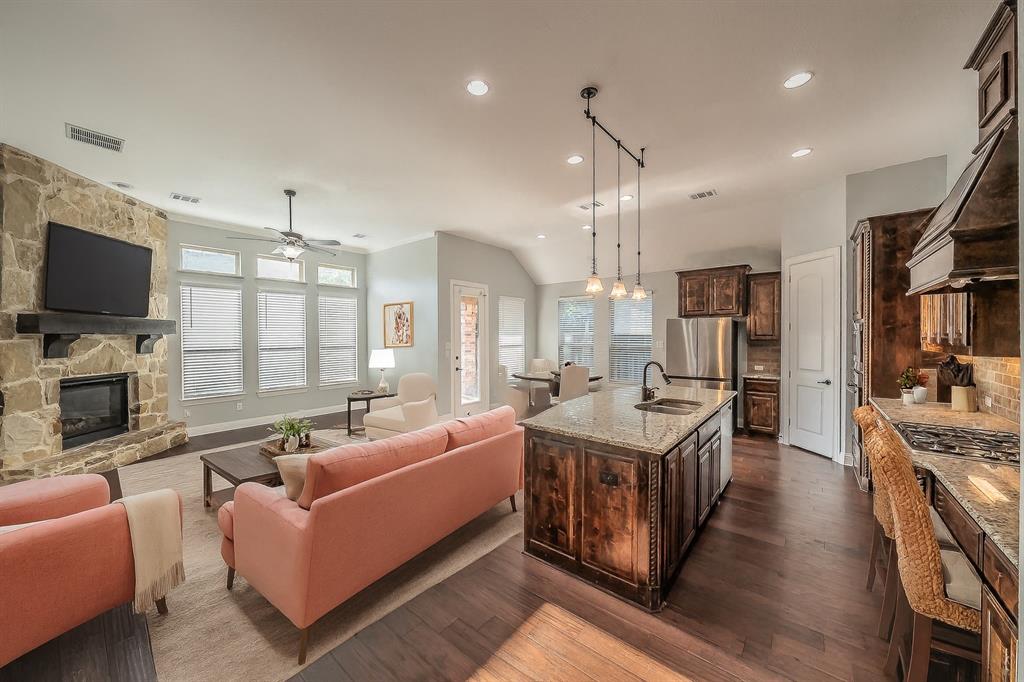 2823 Exeter Drive Trophy Club, TX 76262 - Photo 3 of 40 a living room with fireplace furniture and a flat screen tv