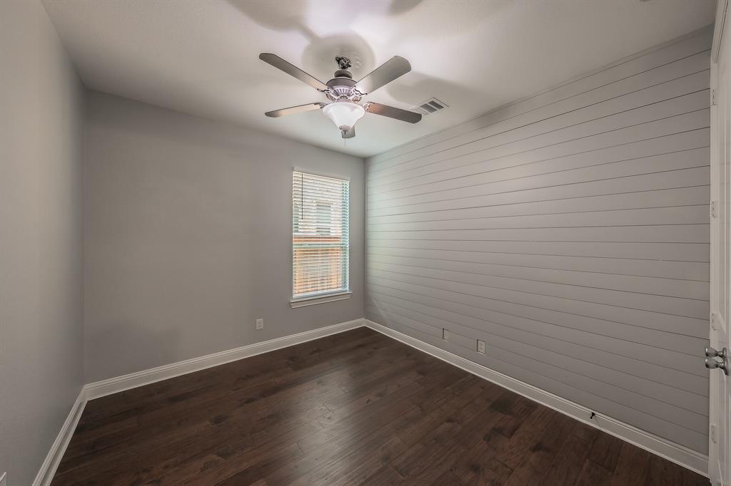 2823 Exeter Drive Trophy Club, TX 76262 - Photo 32 of 40 wooden floor in an empty room with a window