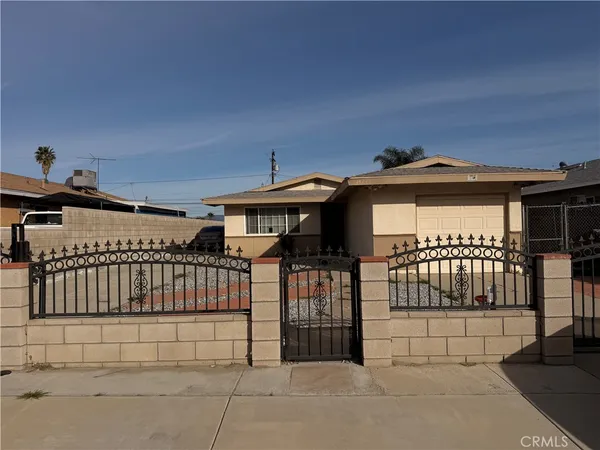 a view of a brick house with many windows
