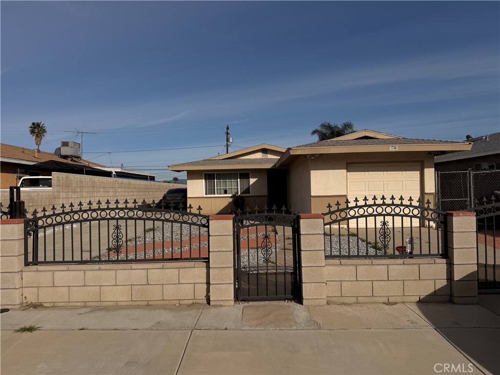 18246 8th Street Bloomington, CA 92316 - Photo 1 of 1 a view of a brick house with many windows