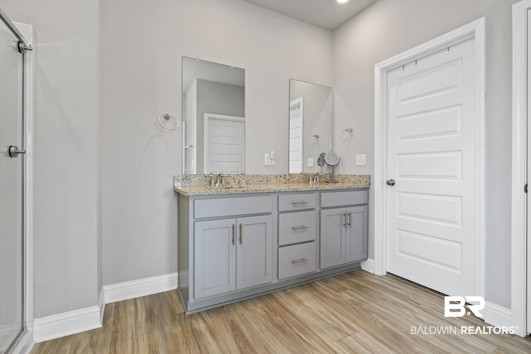 2183 Meadowview Loop Semmes, AL 36575 - Photo 43 of 58 Full bath with double vanity, light wood-style flooring, a shower stall, and recessed lighting