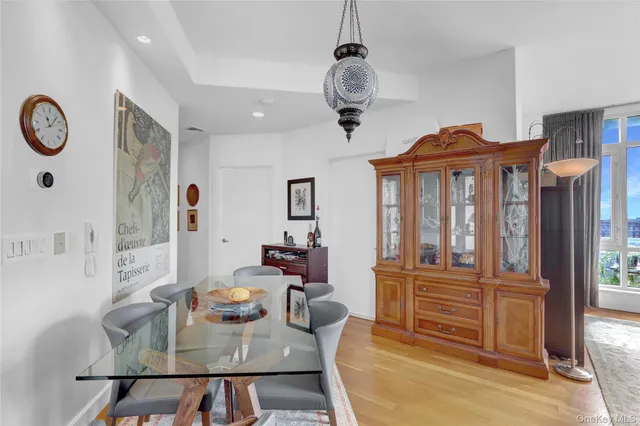 a view of a dining room with furniture window and wooden floor