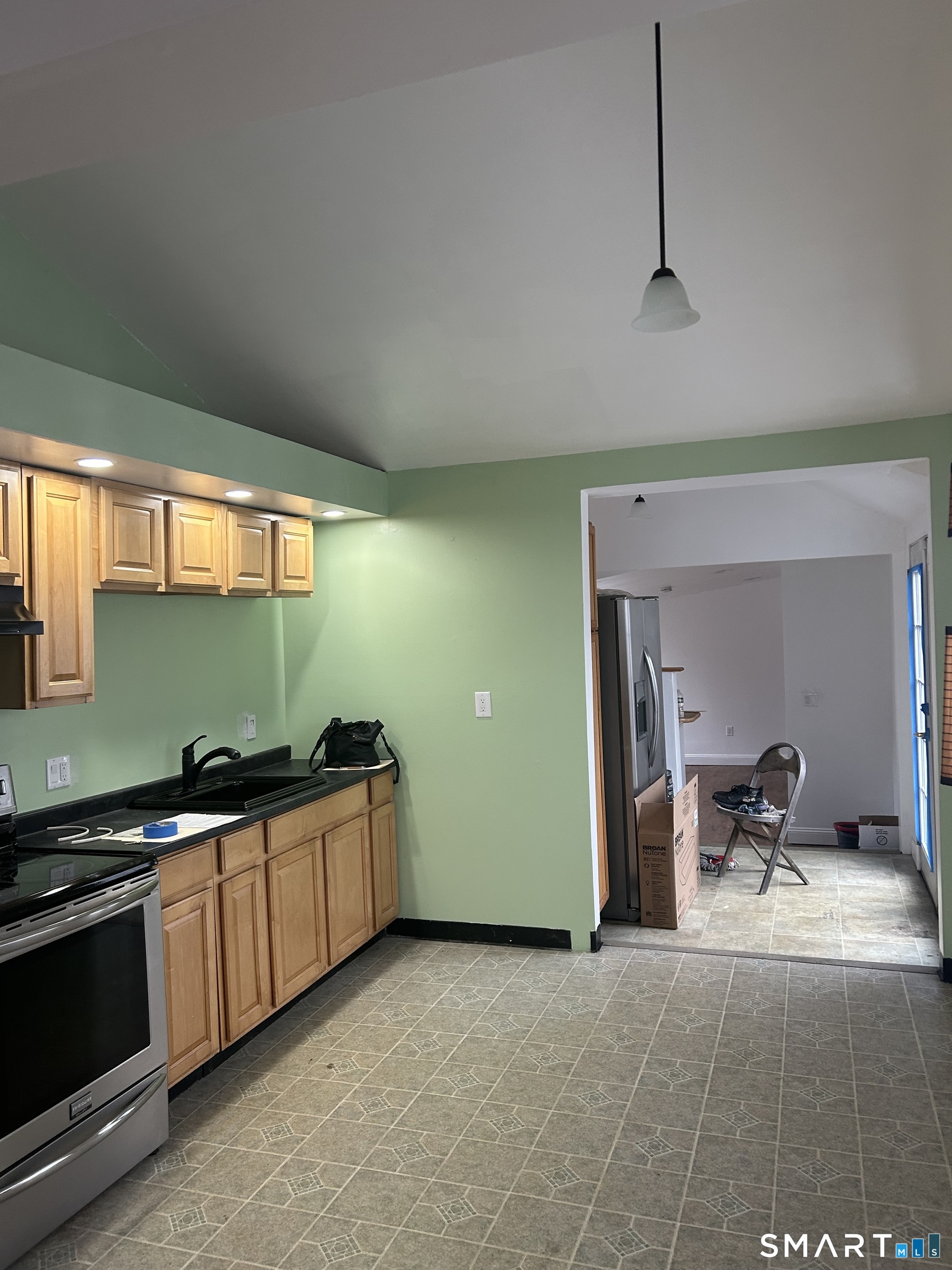 26 Sunnydale Road East Hartford, CT 06118 - Photo 12 of 17 a kitchen with stainless steel appliances a sink stove and cabinets
