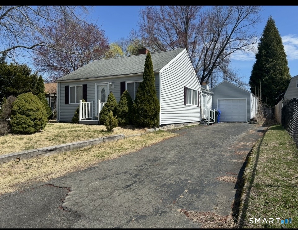 26 Sunnydale Road East Hartford, CT 06118 - Photo 2 of 17 a front view of a house with a yard
