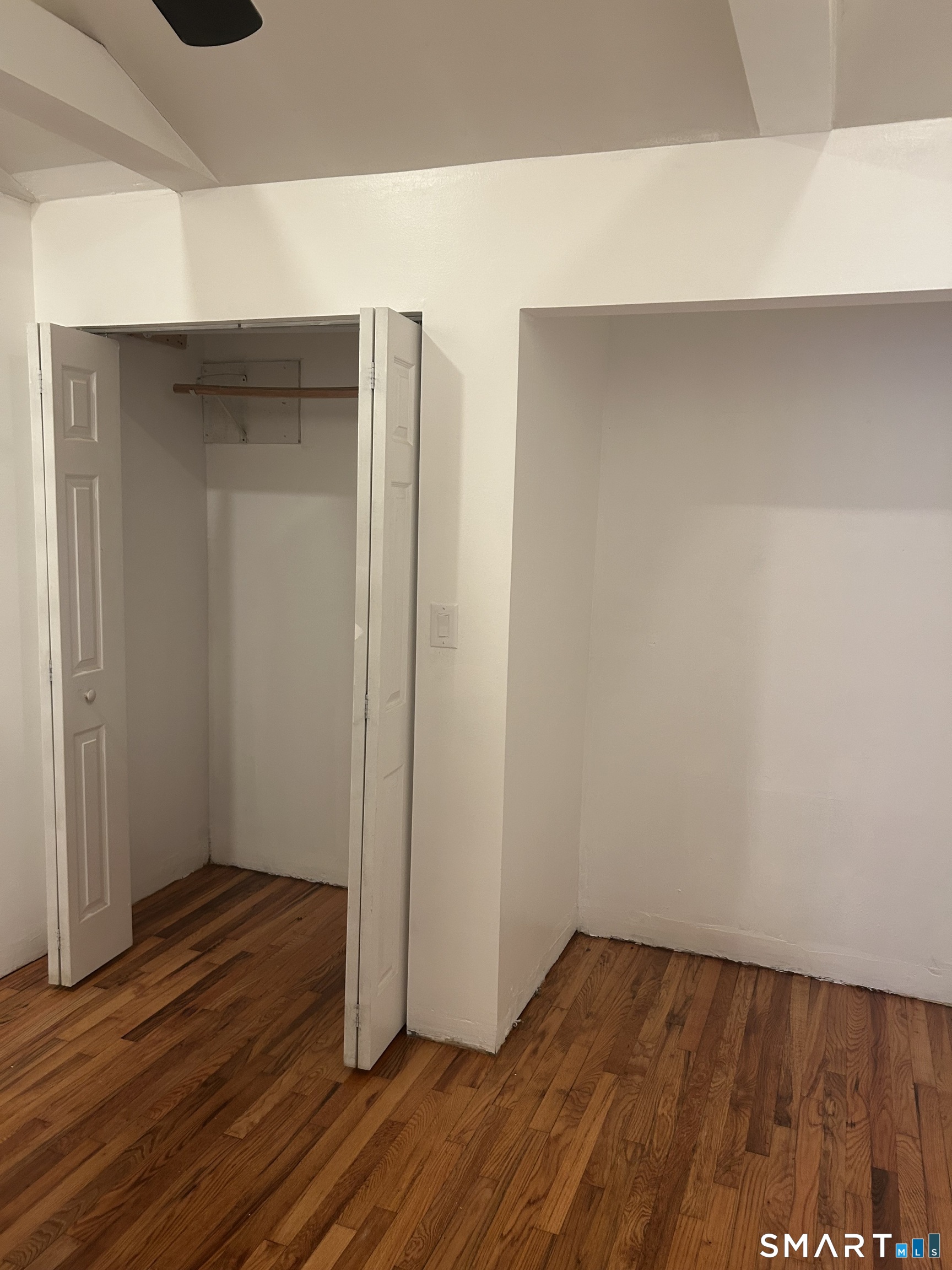 26 Sunnydale Road East Hartford, CT 06118 - Photo 4 of 17 a view of an empty room with wooden floor and closet