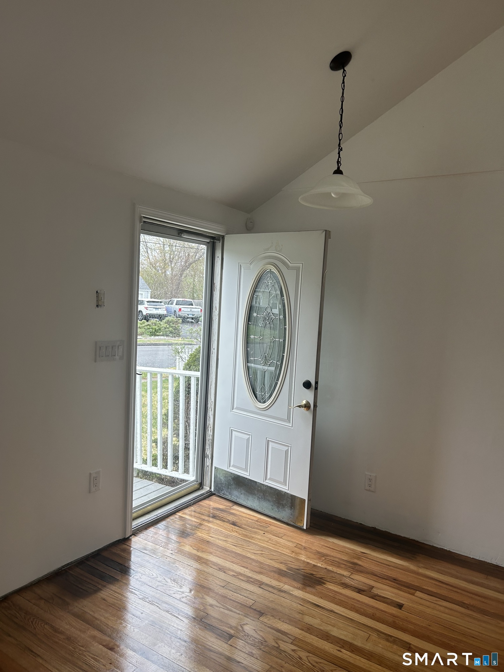 26 Sunnydale Road East Hartford, CT 06118 - Photo 9 of 17 a view of an empty room with a window and wooden floor