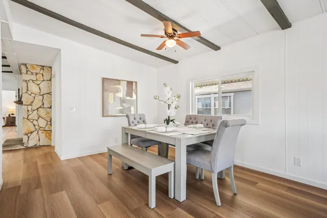 a kitchen with kitchen island a stove sink and microwave