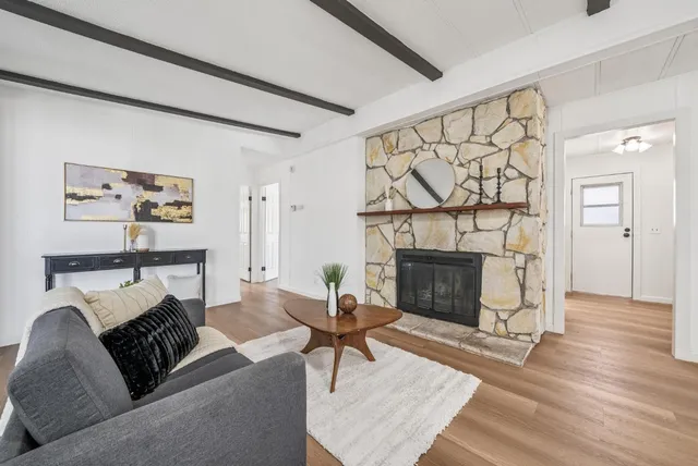 a view of a dining room with furniture and window