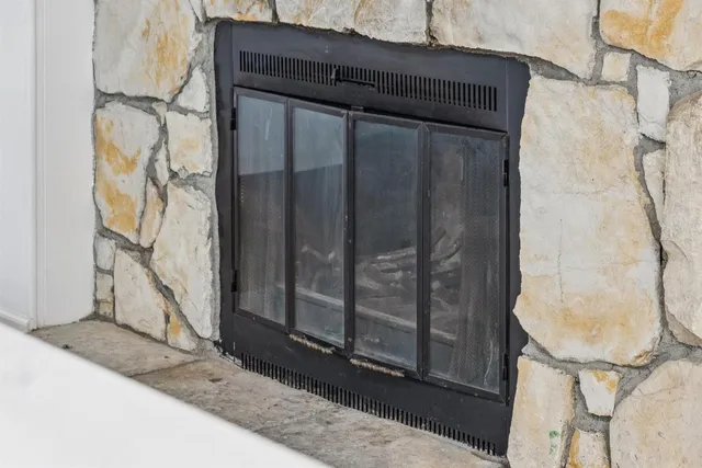 a bedroom with a bed and potted plant