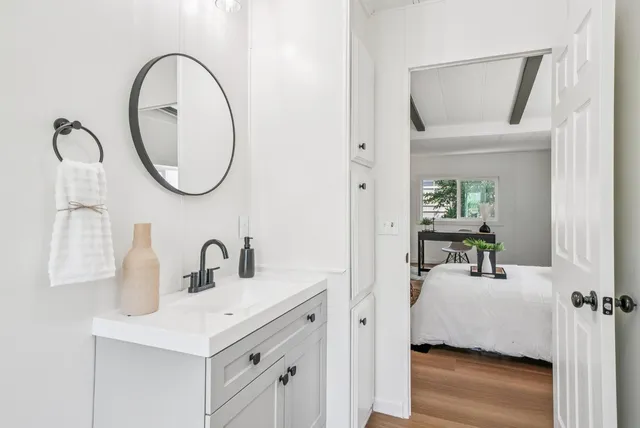 a bedroom with bed and a window