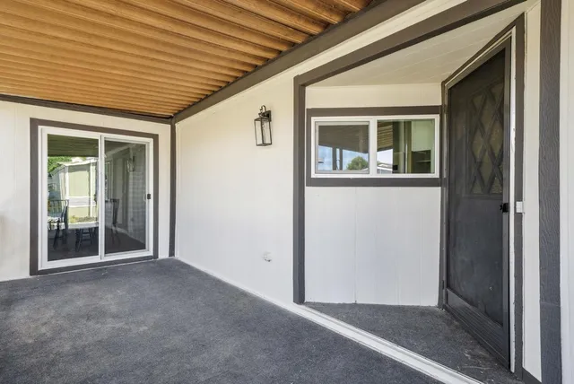 a living room with furniture wooden floor and window