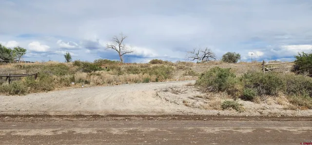 a view of a road with a building in the background