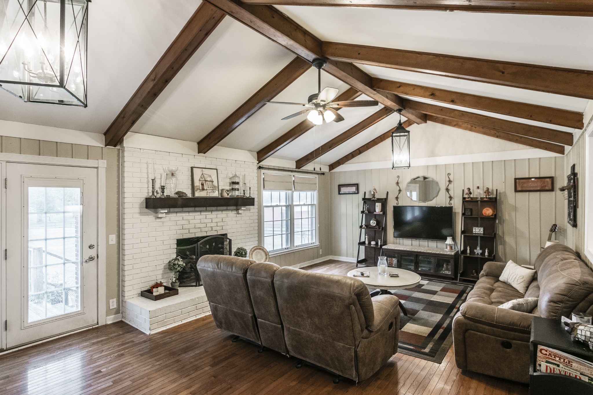 2527 Ewell Elliott Road Springfield, TN 37172 - Photo 13 of 50 a living room with furniture floor to ceiling window and fireplace