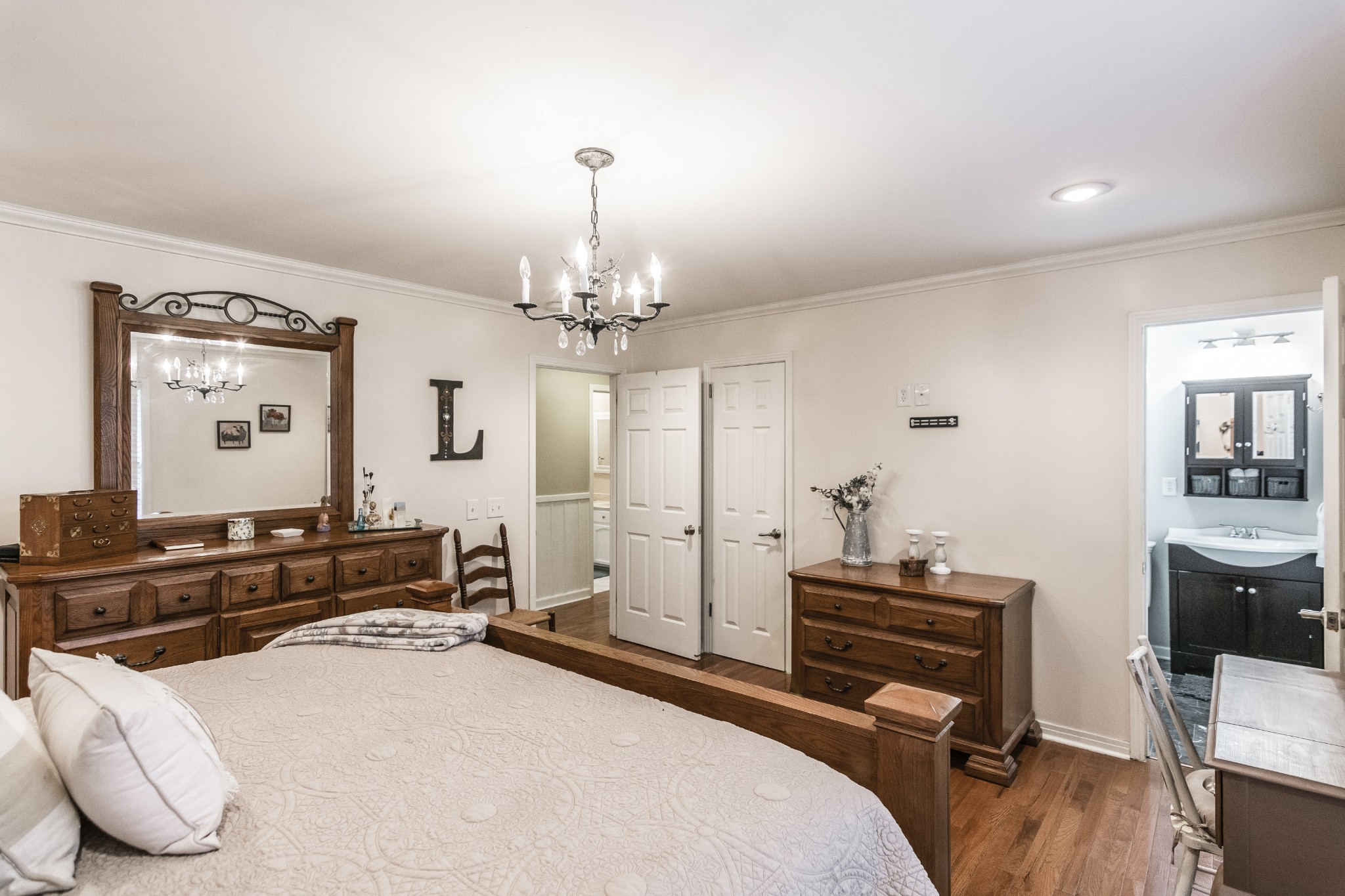 2527 Ewell Elliott Road Springfield, TN 37172 - Photo 18 of 50 a bedroom with a bed and a chandelier