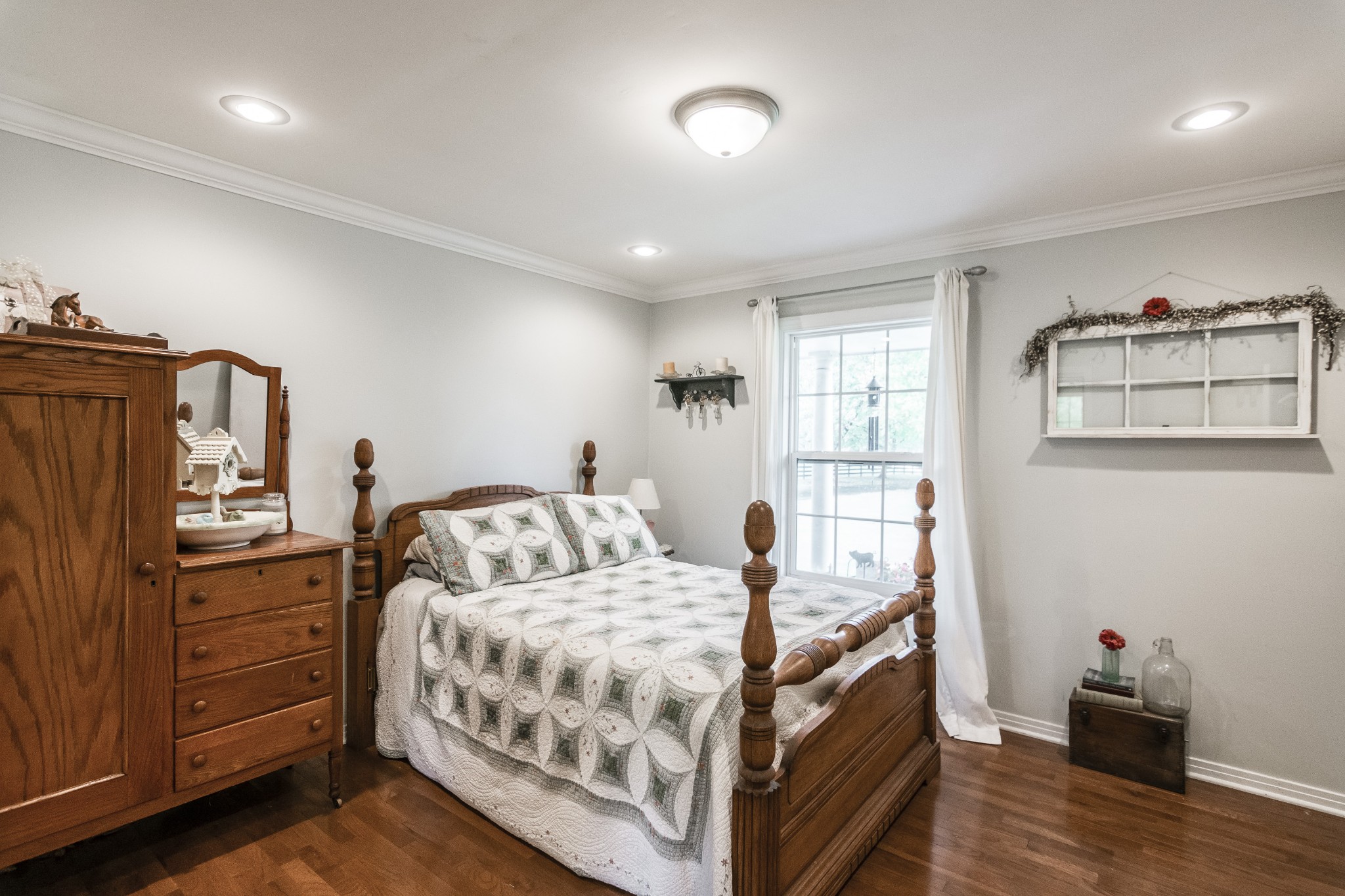 2527 Ewell Elliott Road Springfield, TN 37172 - Photo 25 of 50 a bedroom with a bed and wooden floor