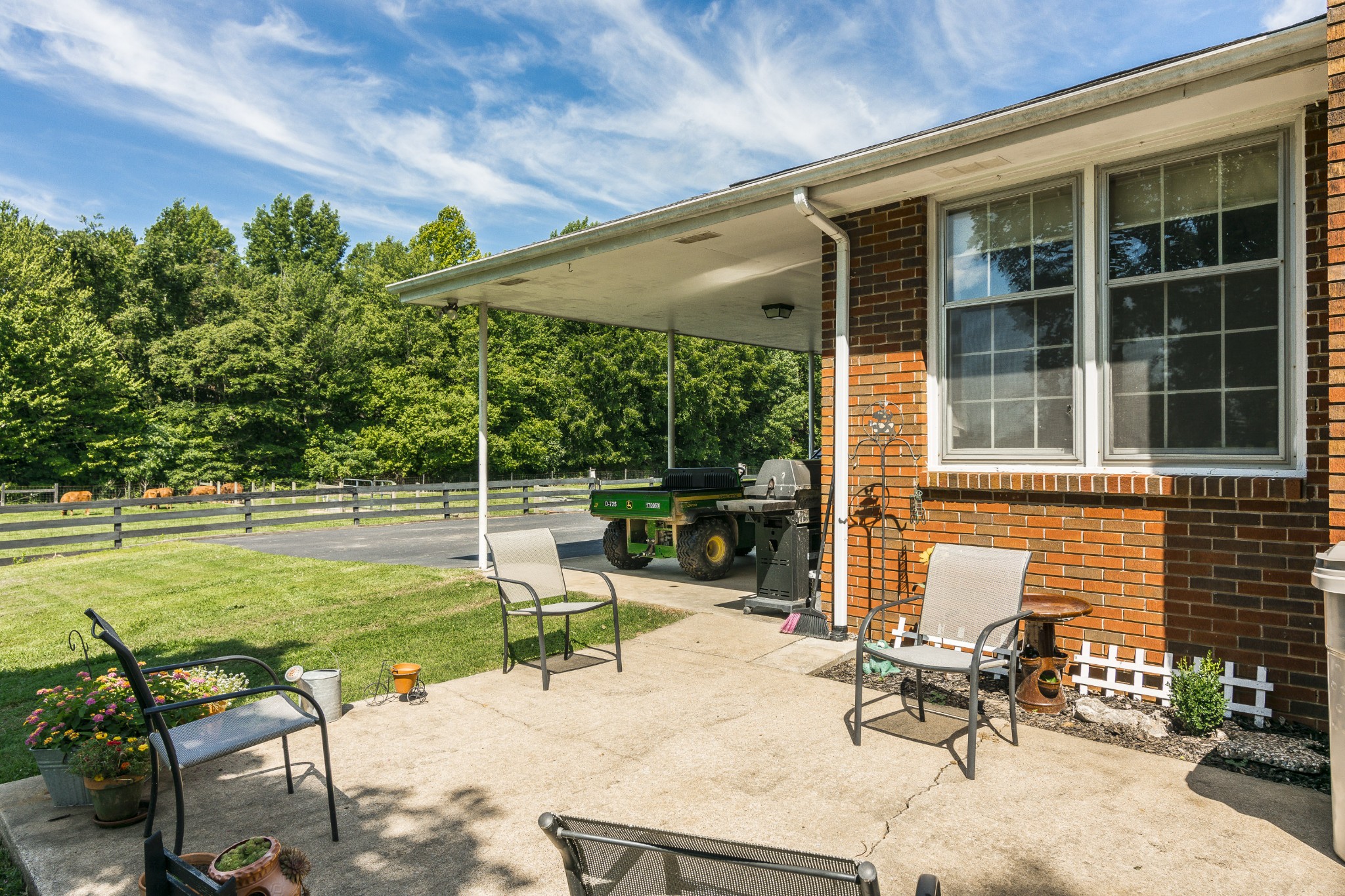 2527 Ewell Elliott Road Springfield, TN 37172 - Photo 38 of 50 a view of a chair and tables in the back yard of the house