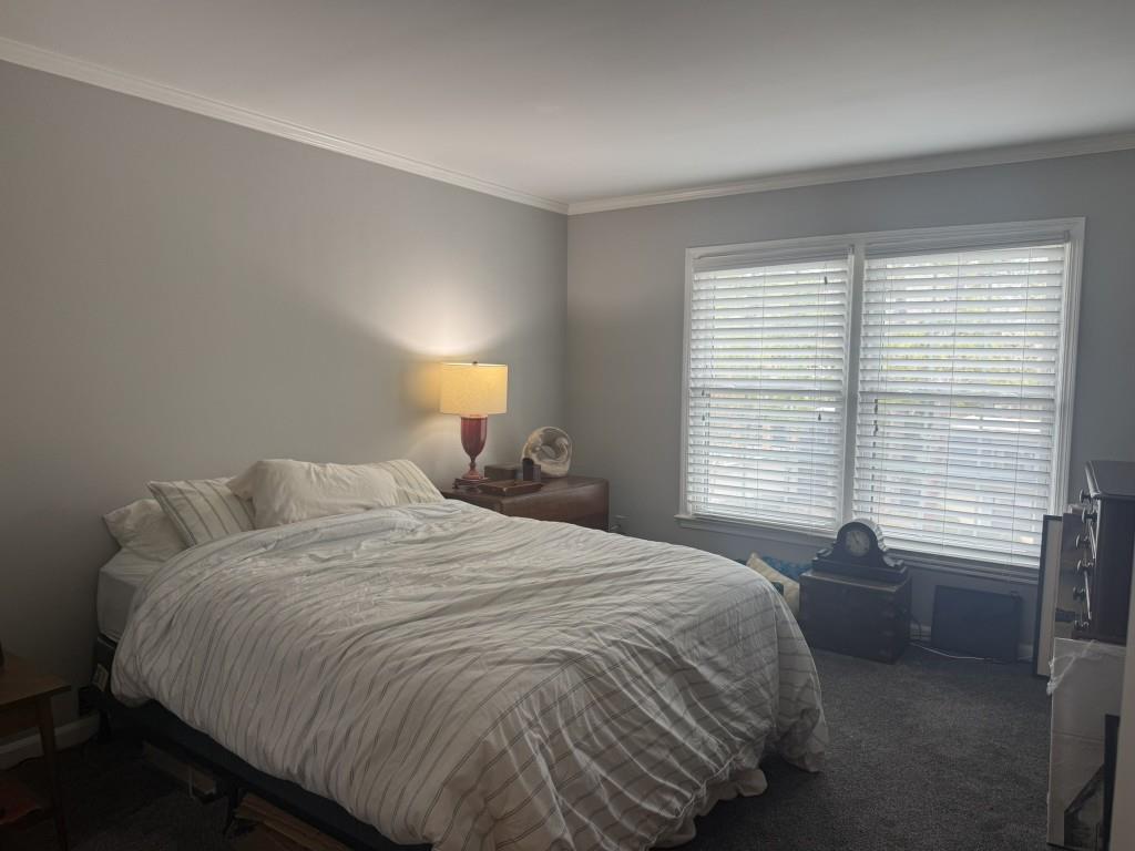 54 La Rue Place Northwest Atlanta, GA 30327 - Photo 13 of 20 a bedroom with a bed and a window