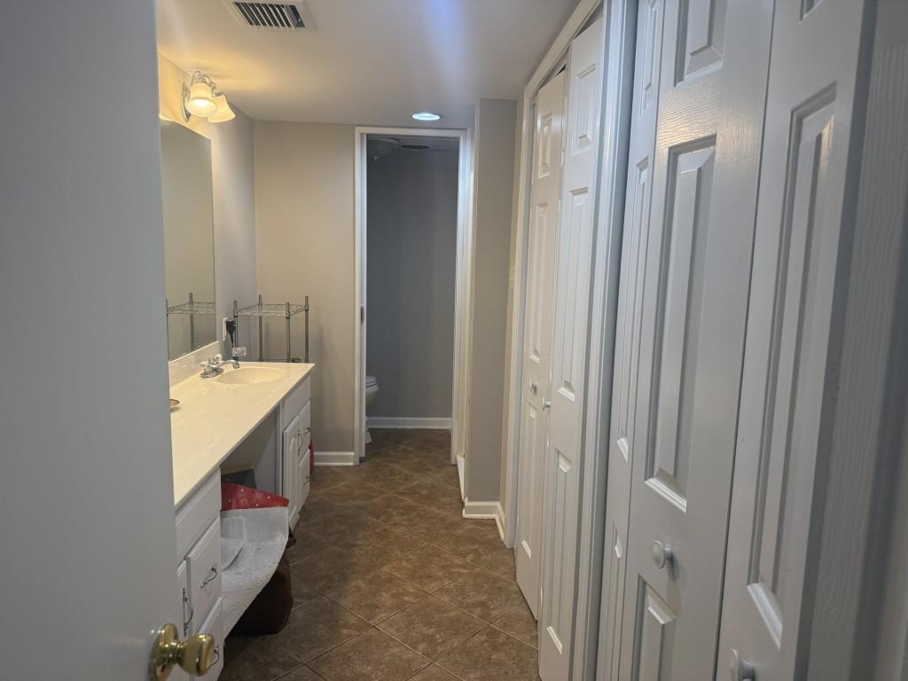 54 La Rue Place Northwest Atlanta, GA 30327 - Photo 14 of 20 a bathroom with a double vanity sink and mirror