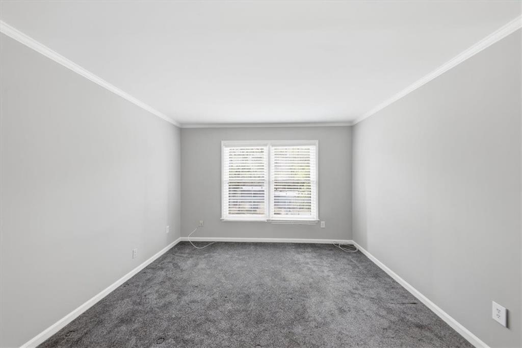 54 La Rue Place Northwest Atlanta, GA 30327 - Photo 17 of 36 an empty room with a window