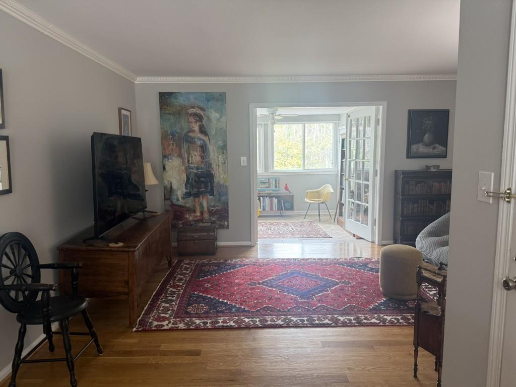 54 La Rue Place Northwest Atlanta, GA 30327 - Photo 18 of 20 a living room with furniture a rug and a flat screen tv