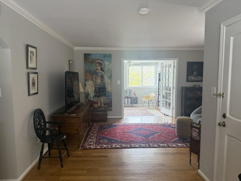 54 La Rue Place Northwest Atlanta, GA 30327 - Photo 19 of 20 a living room with furniture and a wooden floor