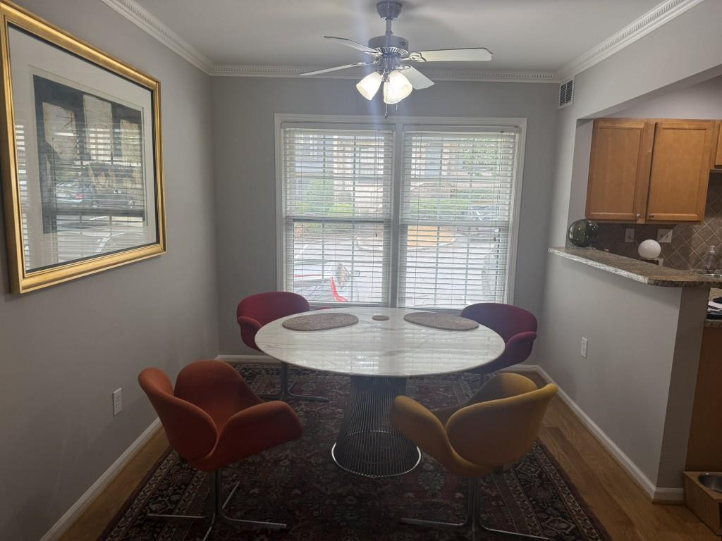 54 La Rue Place Northwest Atlanta, GA 30327 - Photo 2 of 20 a dining room with furniture and window