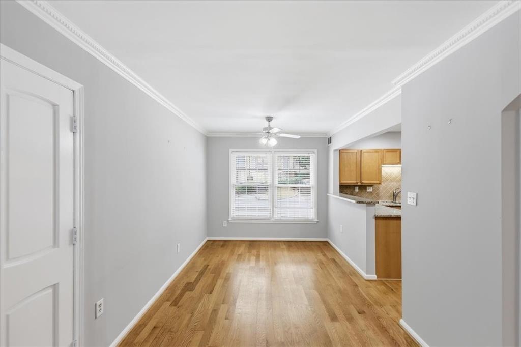 54 La Rue Place Northwest Atlanta, GA 30327 - Photo 2 of 36 a view of a room with wooden floor and a window