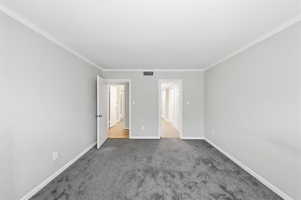 54 La Rue Place Northwest Atlanta, GA 30327 - Photo 22 of 36 a view of an empty room and window