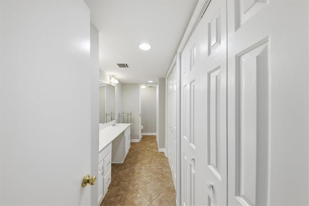 54 La Rue Place Northwest Atlanta, GA 30327 - Photo 23 of 36 a bathroom with a double vanity sink and mirror