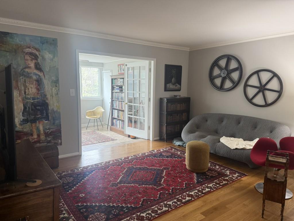 54 La Rue Place Northwest Atlanta, GA 30327 - Photo 6 of 20 a living room with furniture a rug and a window