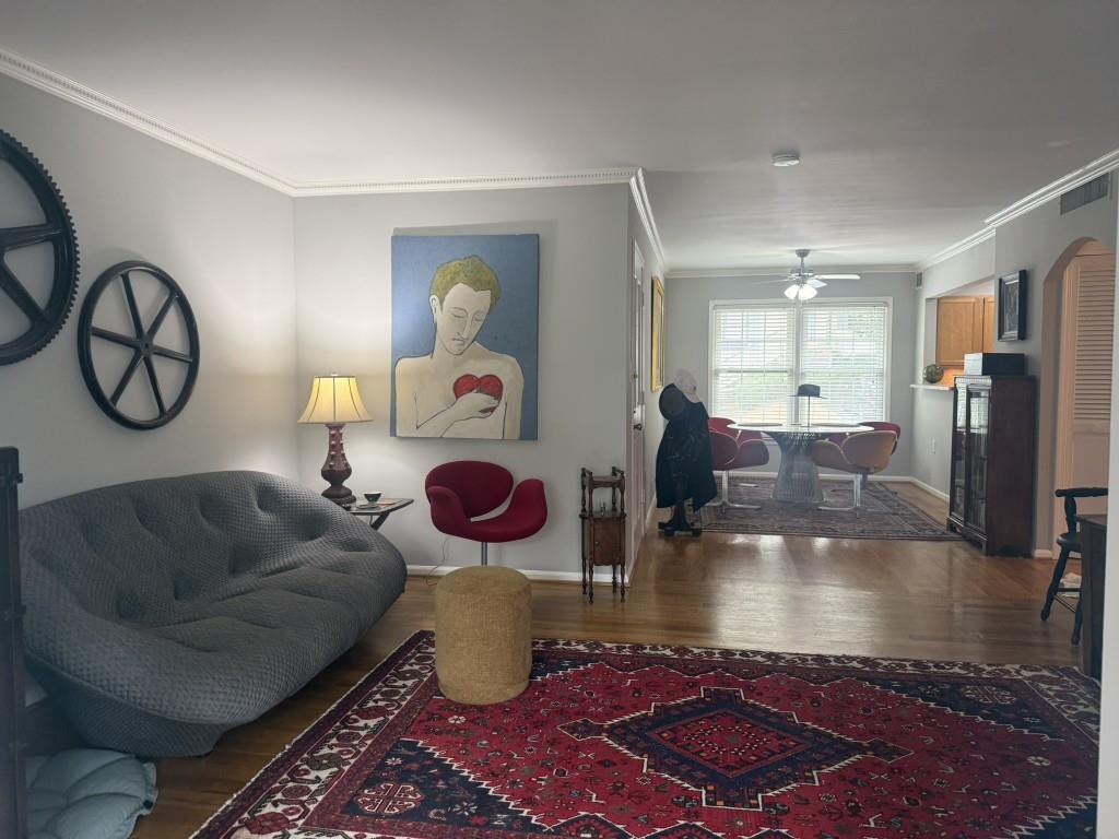 54 La Rue Place Northwest Atlanta, GA 30327 - Photo 8 of 20 a living room with furniture a rug and a large window