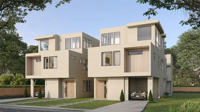 a front view of a residential apartment building with a yard