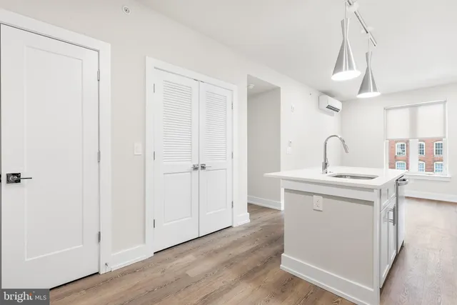 a kitchen with a sink and a refrigerator