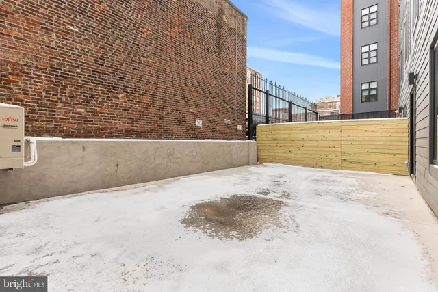 a front view of a building with a street view