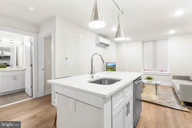 a kitchen with a sink and a refrigerator