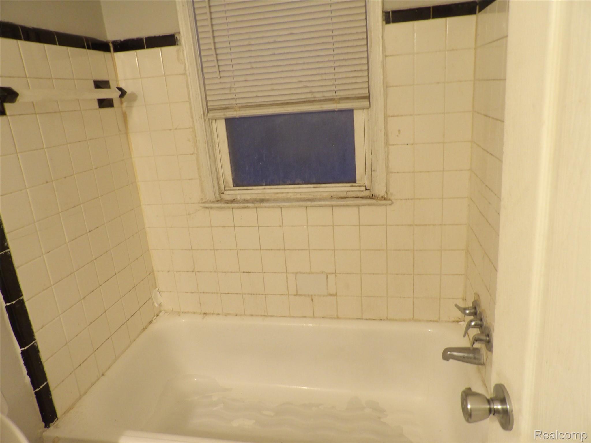 19985 Meyers Road Detroit, MI 48235 - Photo 15 of 16 Bathroom featuring washtub / shower combination