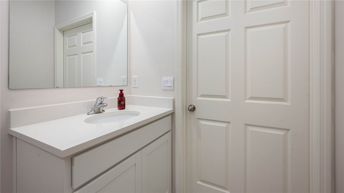 608 Lawson Street Sebastian, FL 32958 - Photo 15 of 30 a bathroom with a sink and a mirror