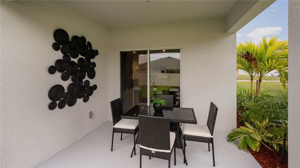 608 Lawson Street Sebastian, FL 32958 - Photo 23 of 30 a dining room with furniture and a potted plant