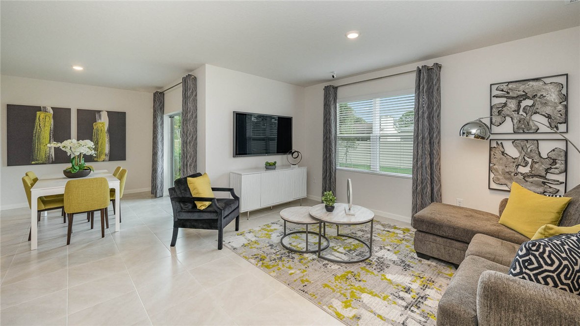 608 Lawson Street Sebastian, FL 32958 - Photo 5 of 30 a living room with furniture and a flat screen tv