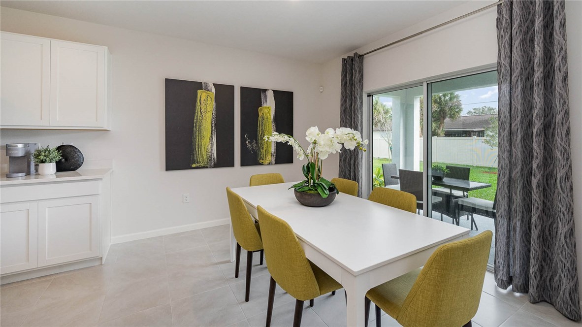 608 Lawson Street Sebastian, FL 32958 - Photo 6 of 30 a view of a dining room with furniture and window