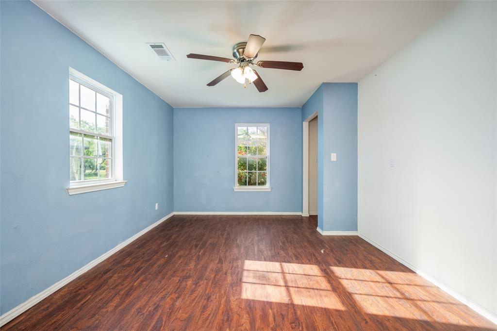 970 McReynolds Road Sanger, TX 76266 - Photo 8 of 25 a view of empty room with wooden floor and fan