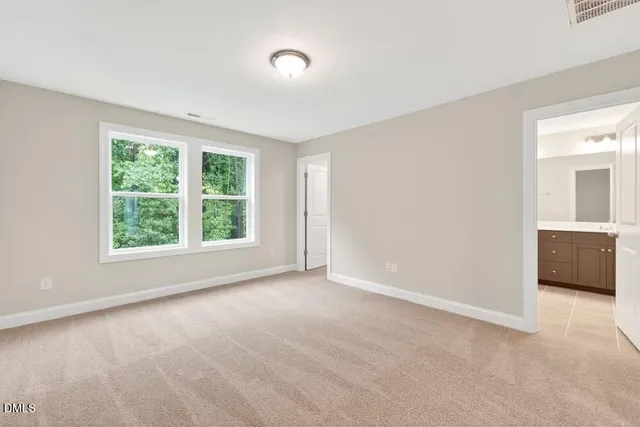 an empty room with windows and a yard