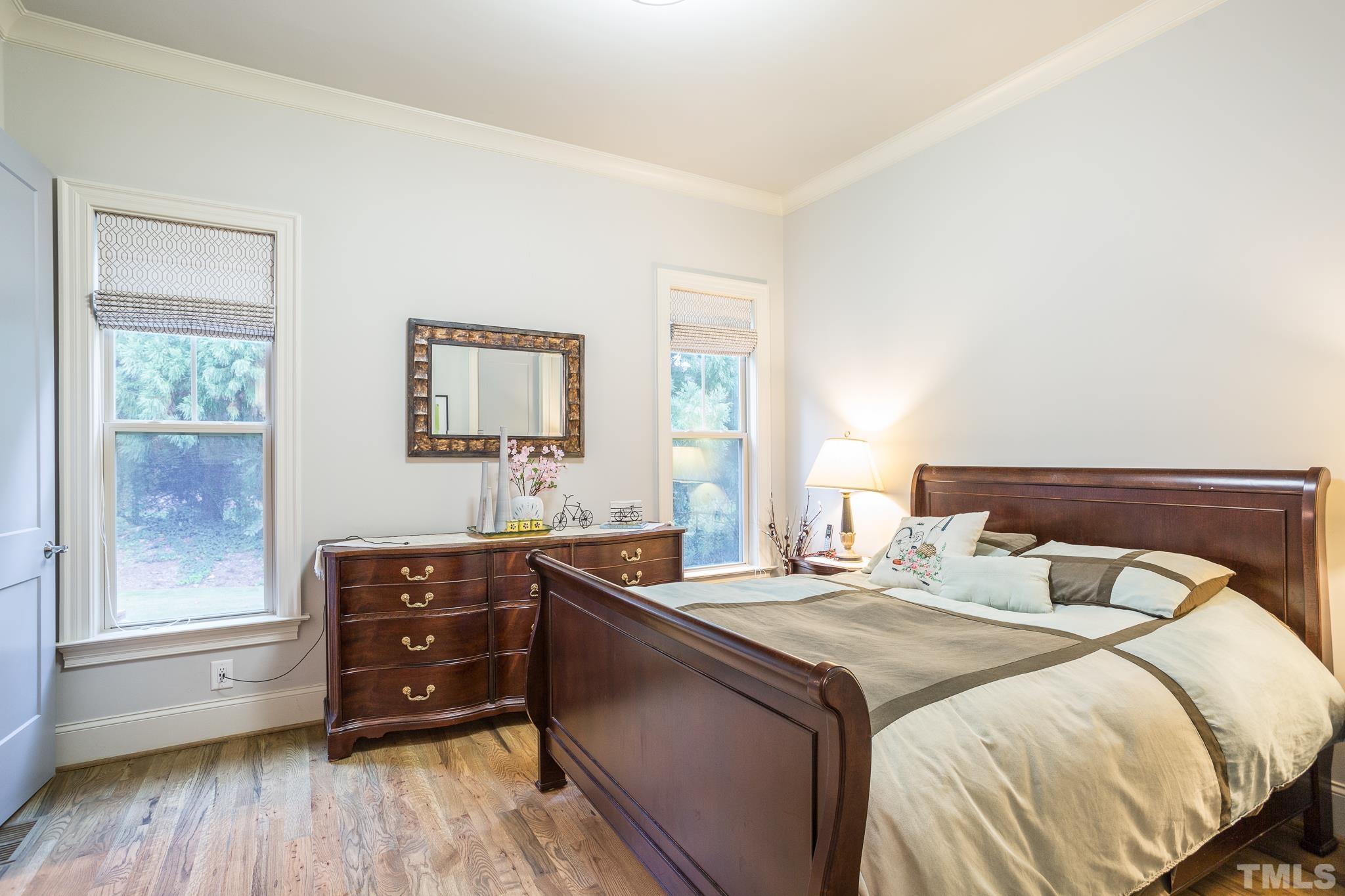 1921 Banbury Road Raleigh, NC 27608 - Photo 19 of 30 a bedroom with a bed and a window