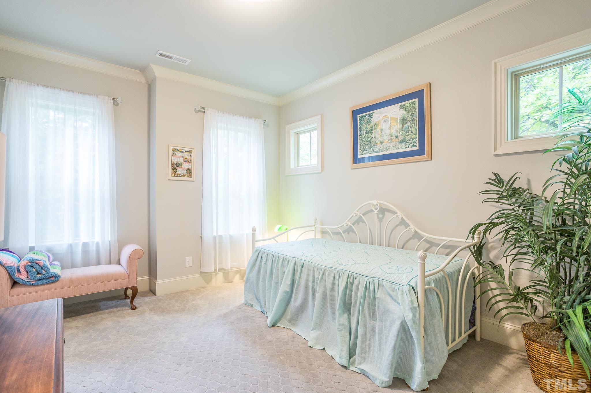1921 Banbury Road Raleigh, NC 27608 - Photo 24 of 30 a bedroom with a bed and a couch