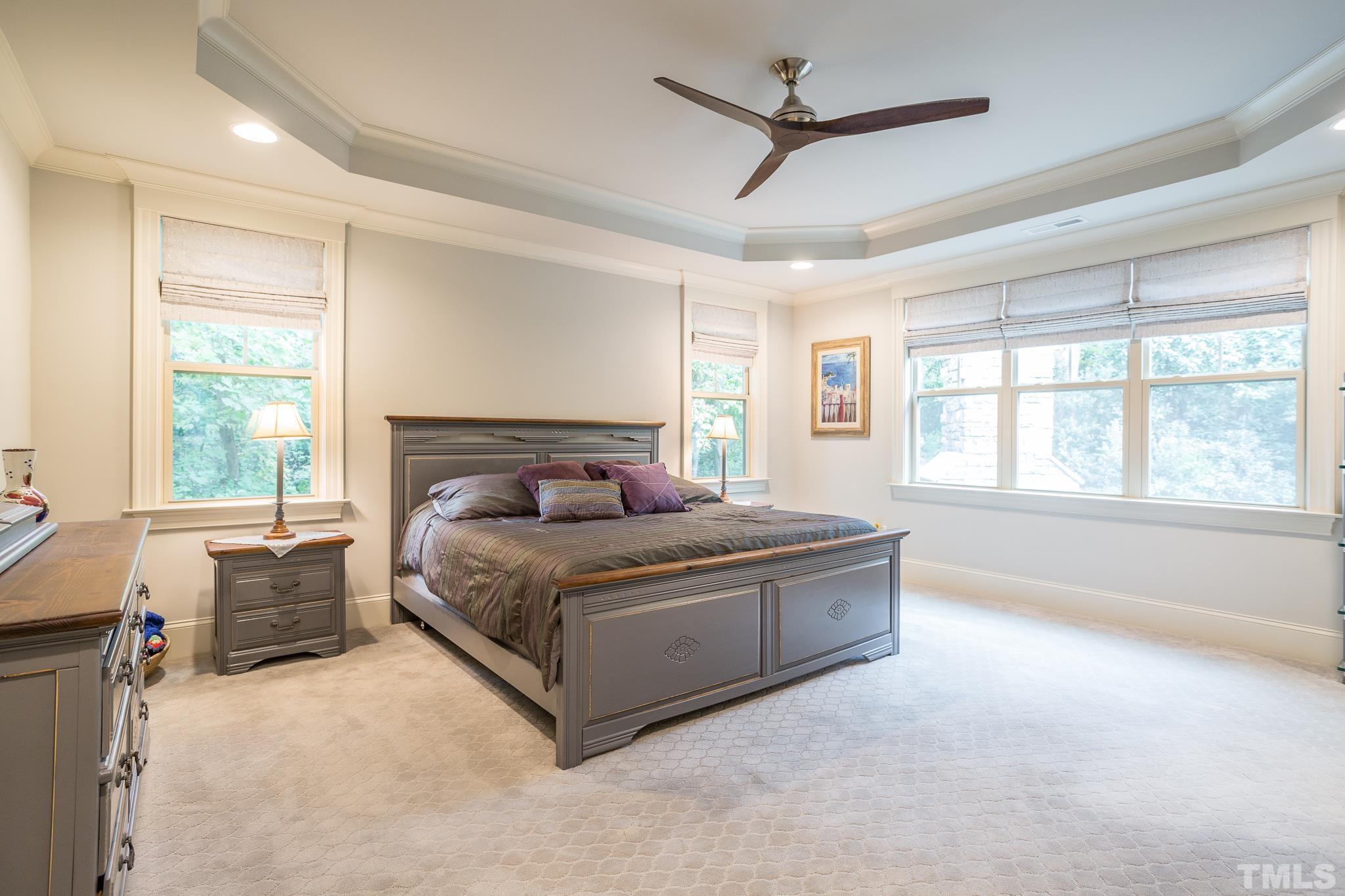 1921 Banbury Road Raleigh, NC 27608 - Photo 26 of 30 a spacious bedroom with a large bed and a large window