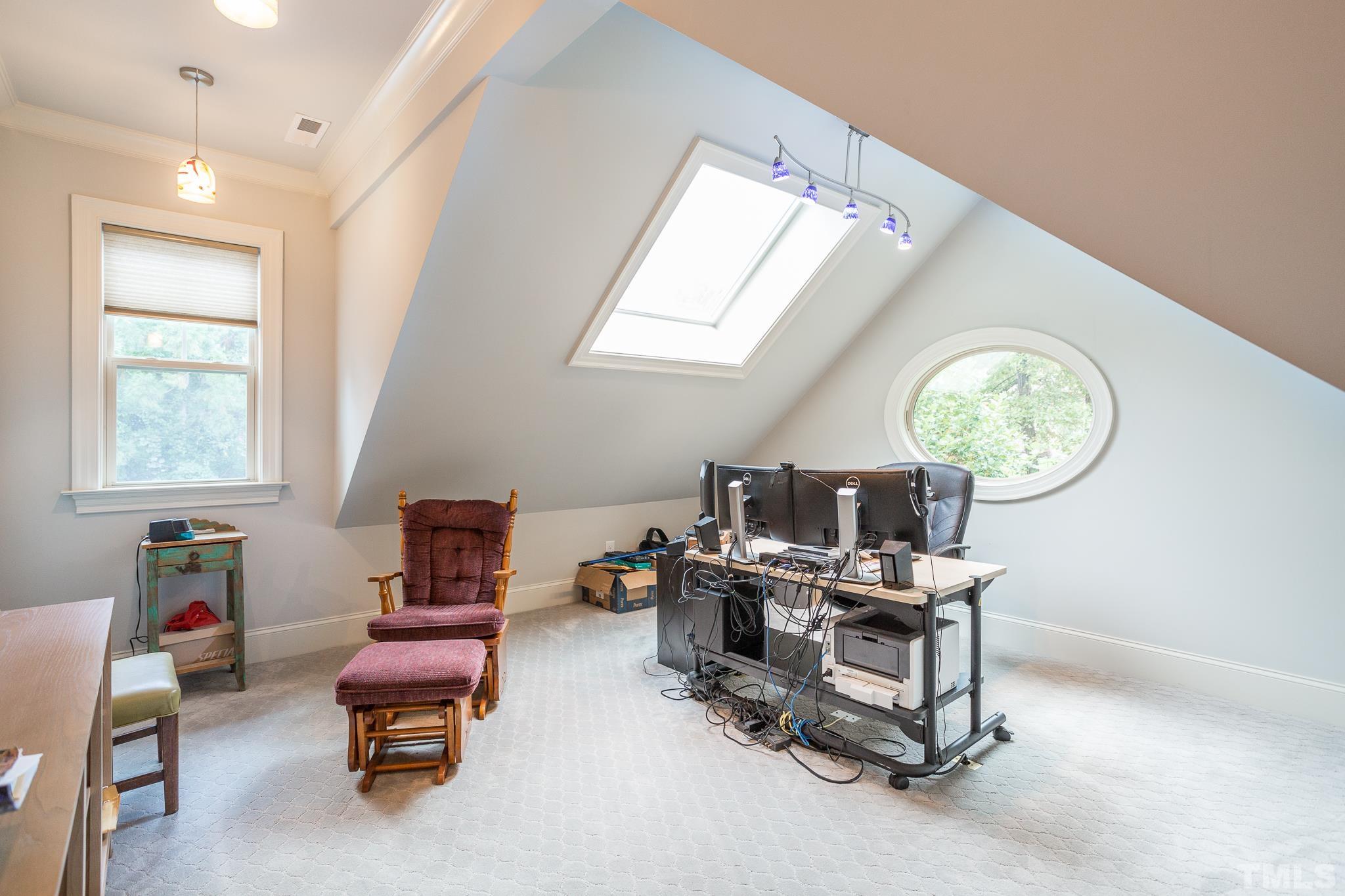 1921 Banbury Road Raleigh, NC 27608 - Photo 28 of 30 a view of a workspace with furniture and a window
