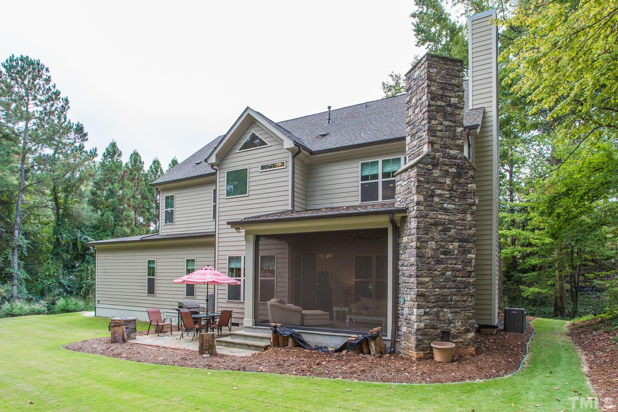 1921 Banbury Road Raleigh, NC 27608 - Photo 4 of 30 a view of a chair and table in front of house